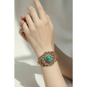 Stunning Vintage Gold-Tone Filigree Cuff Bracelet with Green Cabochon Gem